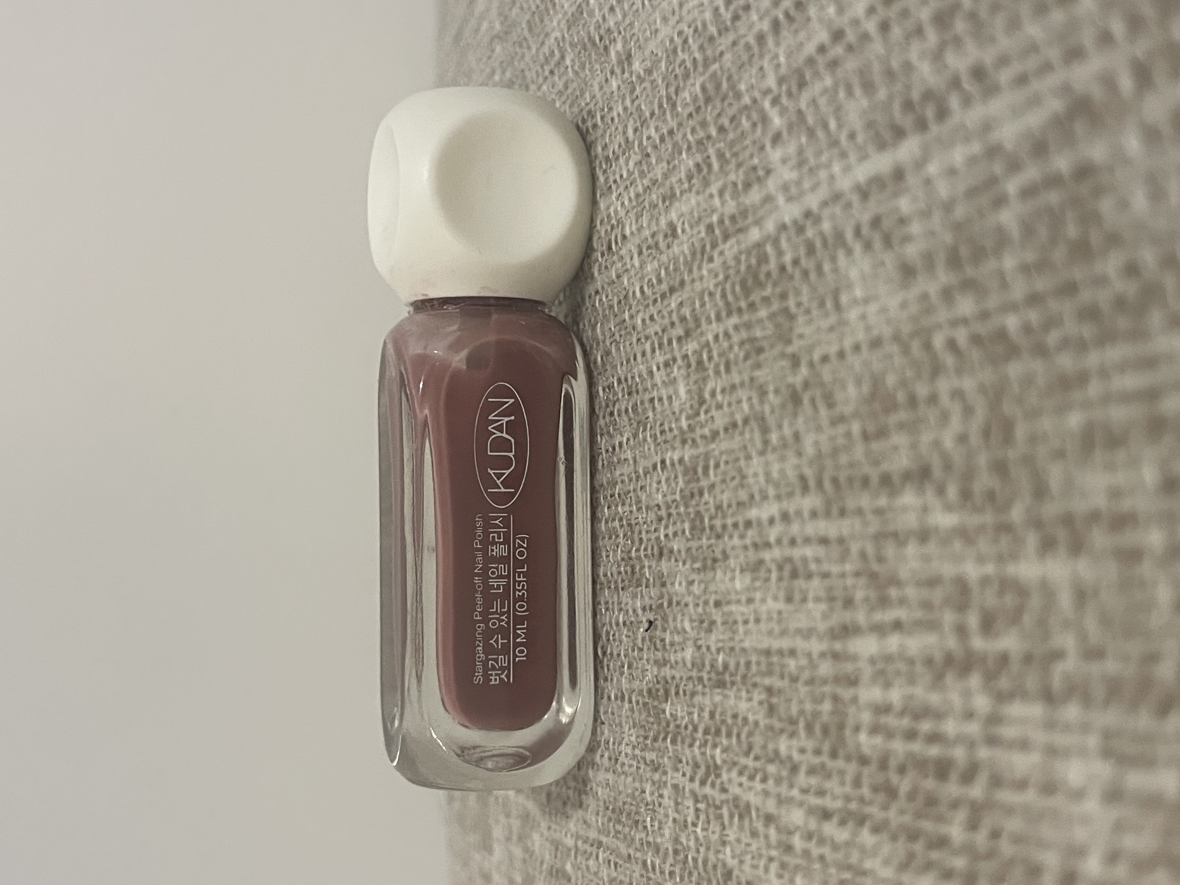 On Its Side View of Real Nail Polish Bottle